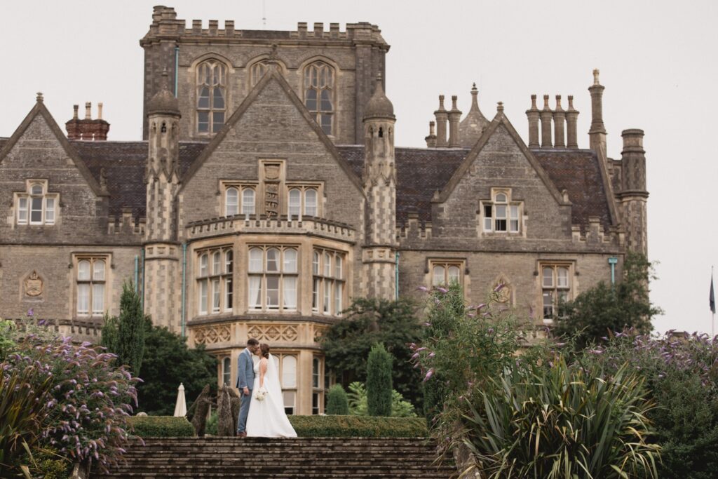 92 bride groom kiss de vere hotel garden steps wotton under edge oxford wedding photographers