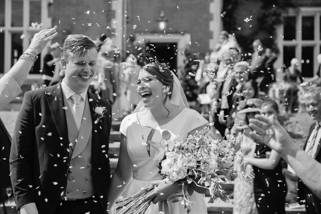 bride groom enjoys thicket priory confetti shower thorganby york oxford wedding photographers