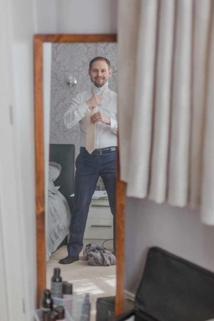09 grooms mirror reflection groom prep london oxford wedding photographers