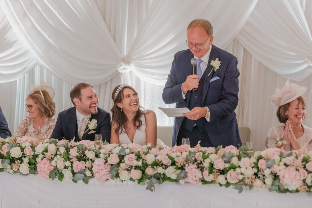 105 laughing bridal party hear funny speech kimpton fitzroy london hotel reception oxfordshire wedding photography