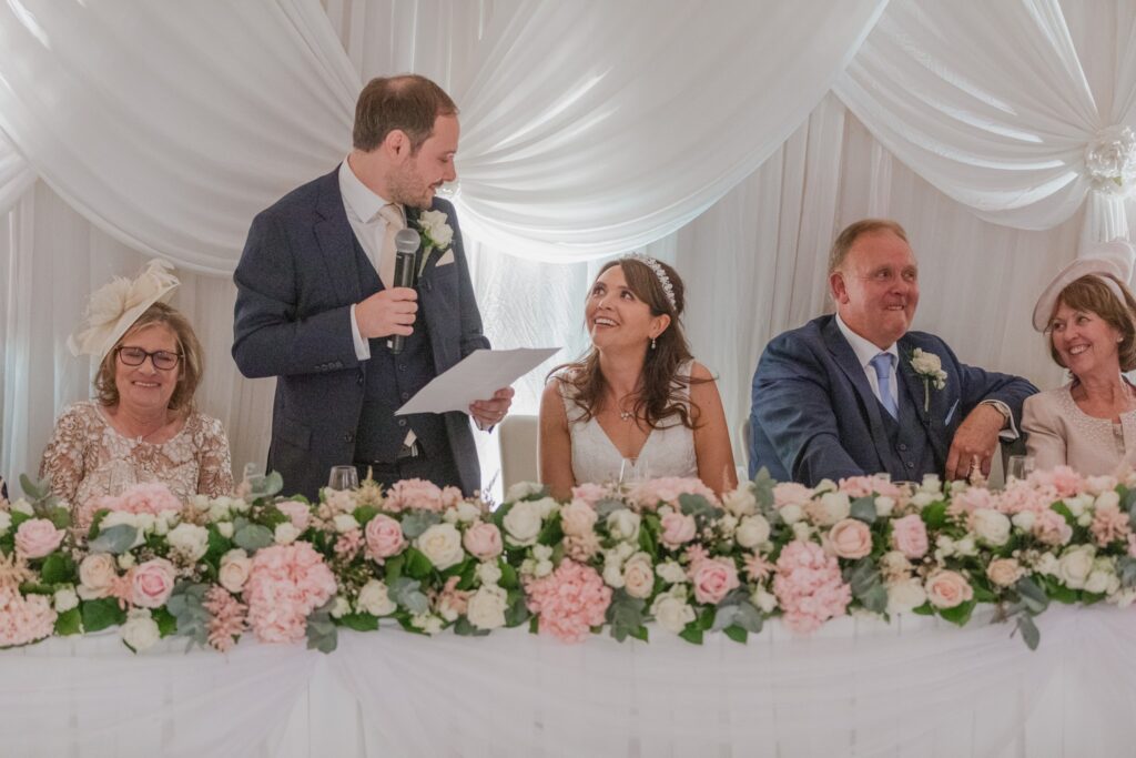 113 laughing guests hear grooms speech kimpton fitzroy london hotel oxfordshire wedding photographers