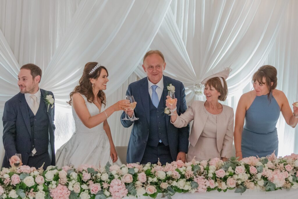 120 bridal party raise glasses kimpton fitzroy london hotel reception oxfordshire wedding photography