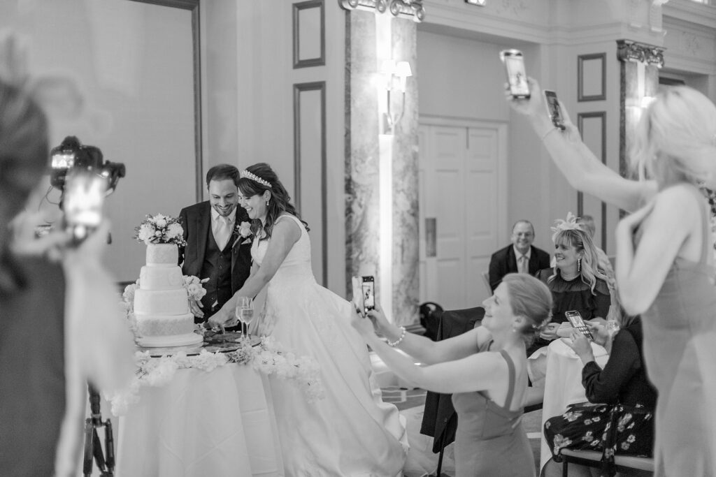 124 guests bridesmaids photograph cake cutting ceremony kimpton fitzroy london hotel oxfordshire wedding photographer
