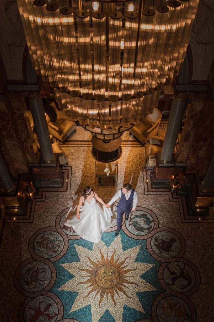 142 bride groom walk holding hands kimpton fitzroy london hotel lobby oxfordshire wedding photographer