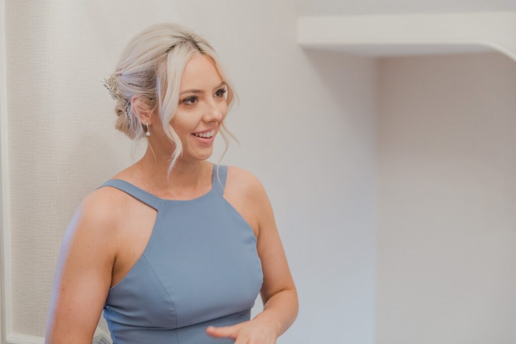 20 smiling bridesmaid completes preparatioon london oxford wedding photographer