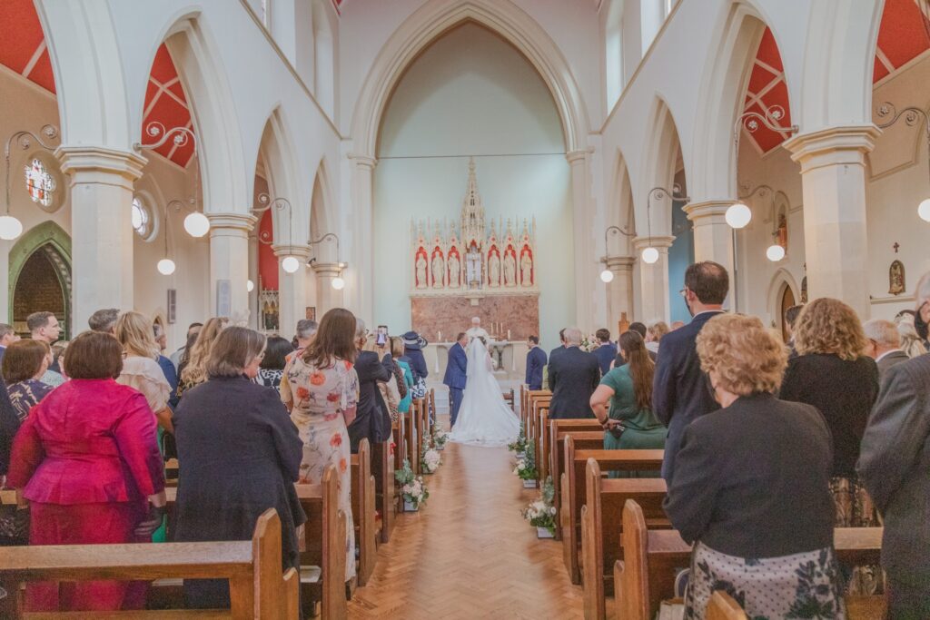 35 guests watch marriage ceremon st peter in chains church north london oxfordshire wedding photographer