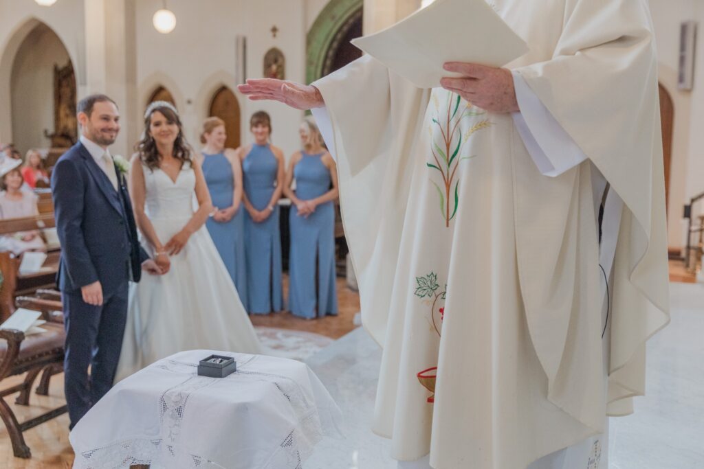 44 priest blesses rings st peter in chains marriage ceremony north london oxford wedding photographer