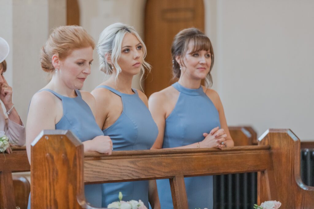 50 bridesmaids hear priest st peter in chains church ceremony north london oxford wedding photographers