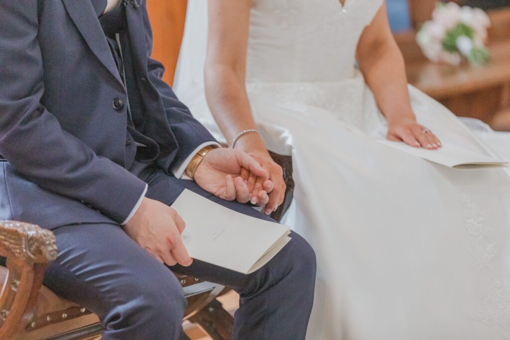 53 bride groom hold hands st peter in chains marriage ceremony north london oxfordshire wedding photographers