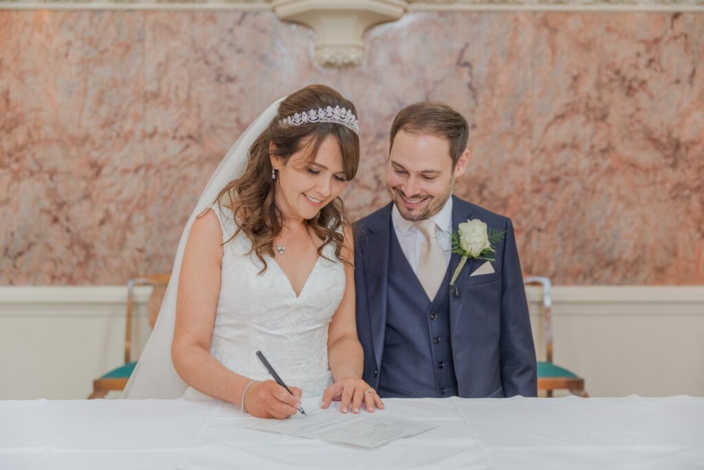 56 smiling bride groom marriage signing ceremony st peter in chains church north london oxford wedding photographers