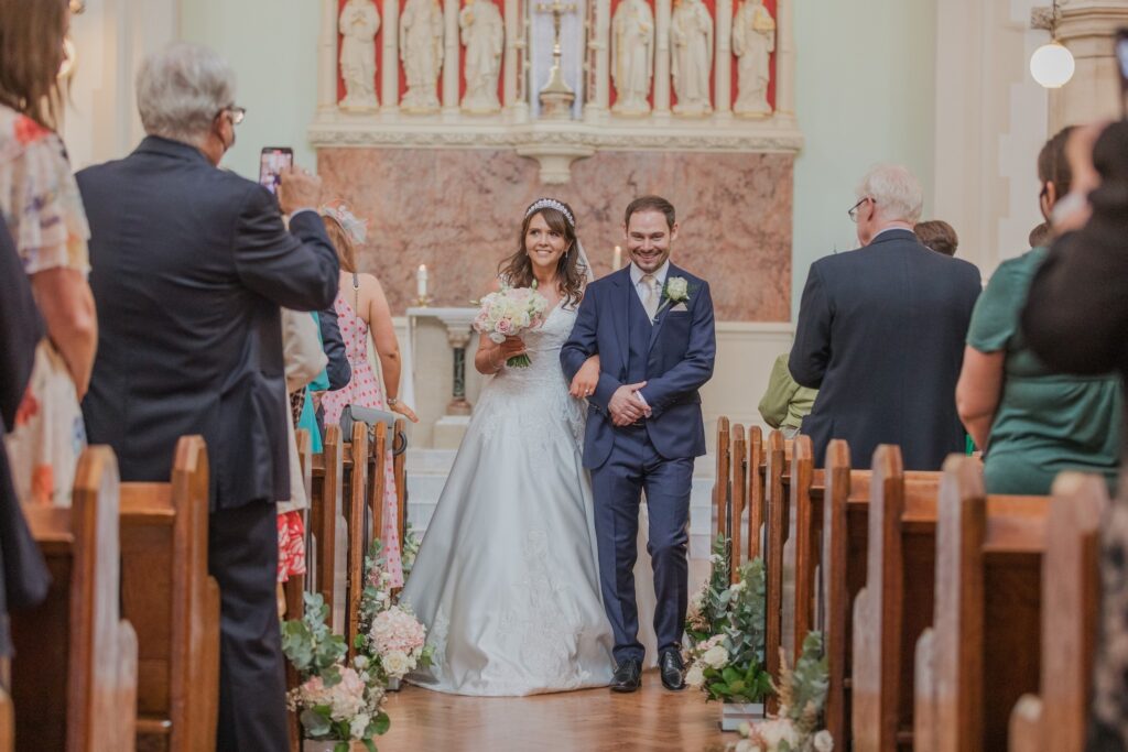 57 bride groom begin aisle walk st peter in chains church london oxford wedding photography