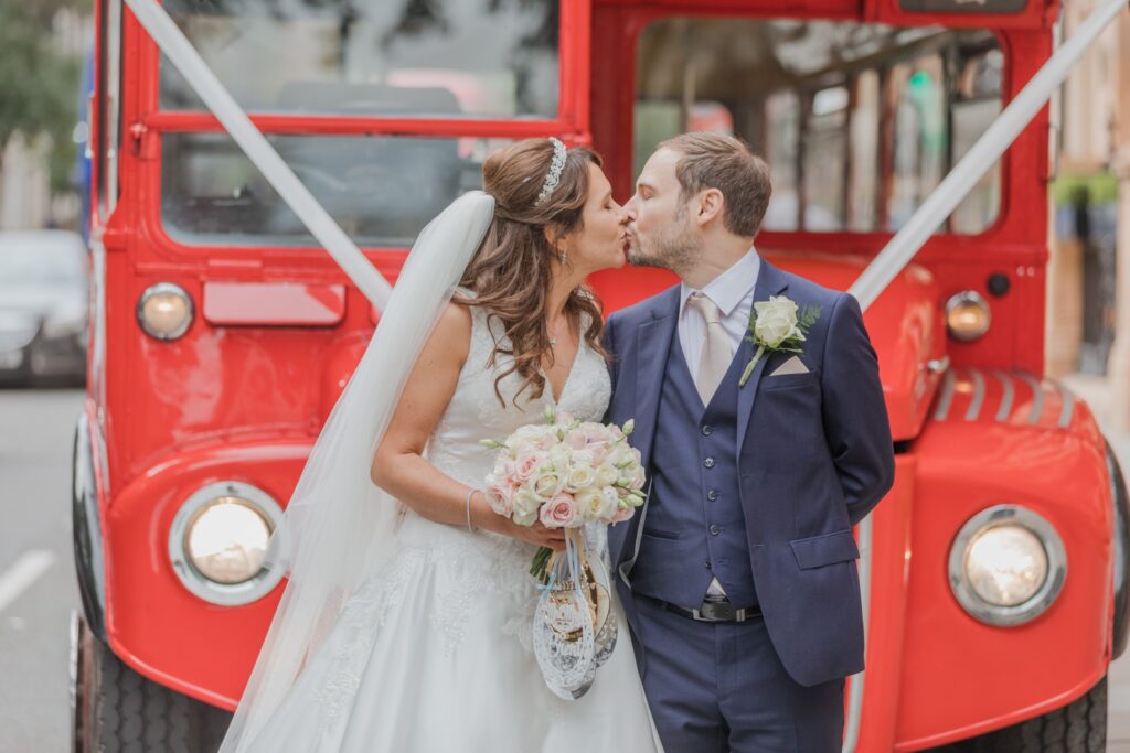 76 bride groom kiss beside red double decker bus russell square london oxfordshire wedding photographers