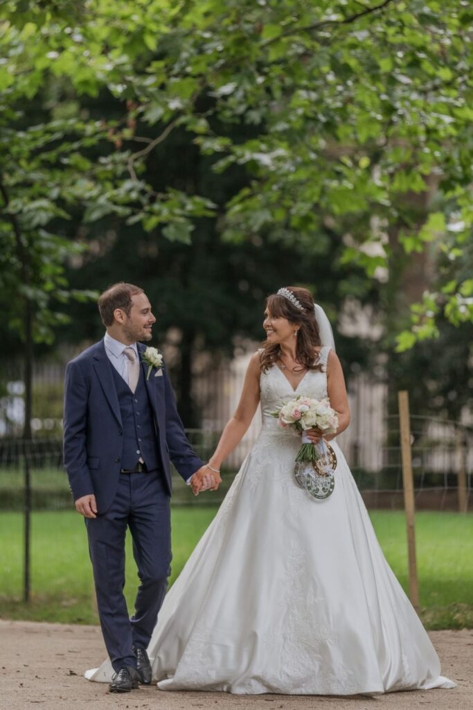 86 bride groom stroll holding hands russell square gardens central london oxford wedding photography