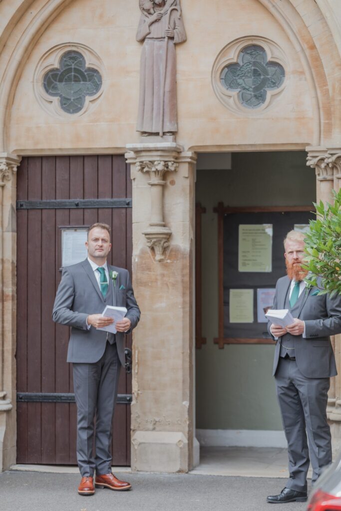 20 groomsmen hold service order cards oxford oratory wedding s r urwin photographers oxfordshire