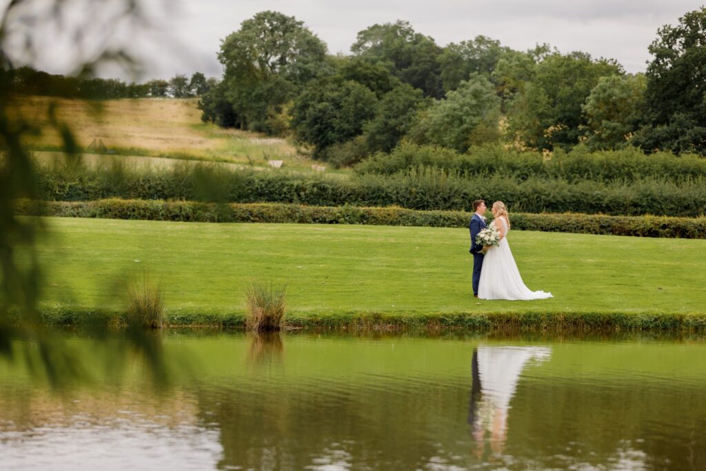 55 bride grooms lake reflection horsley lodge golf club derbyshire oxfordshire wedding photographer