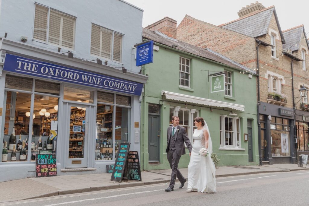 60 groom bride stroll down street oxford city centre oxfordshire wedding photographers