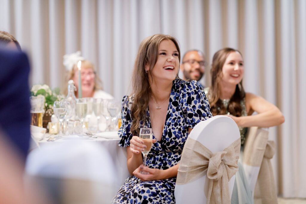 77 smiling guests hear grooms speech horsley lodge hotel reception derbyshire oxfordshire wedding photographers