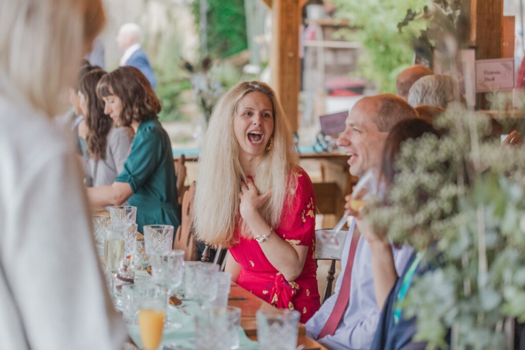 79 laughing reception guests ye olde swan wedding barn radcot s r urwin photographer oxfordshire