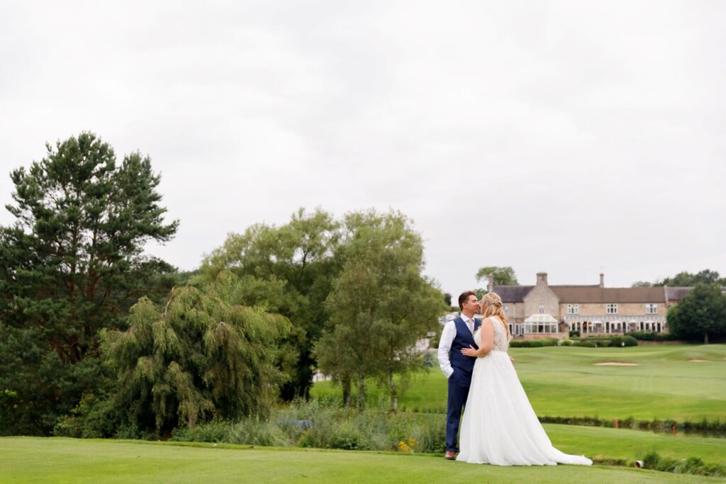 88 bride groom kiss horsley lodge golf club grounds derby oxfordshire wedding photographers