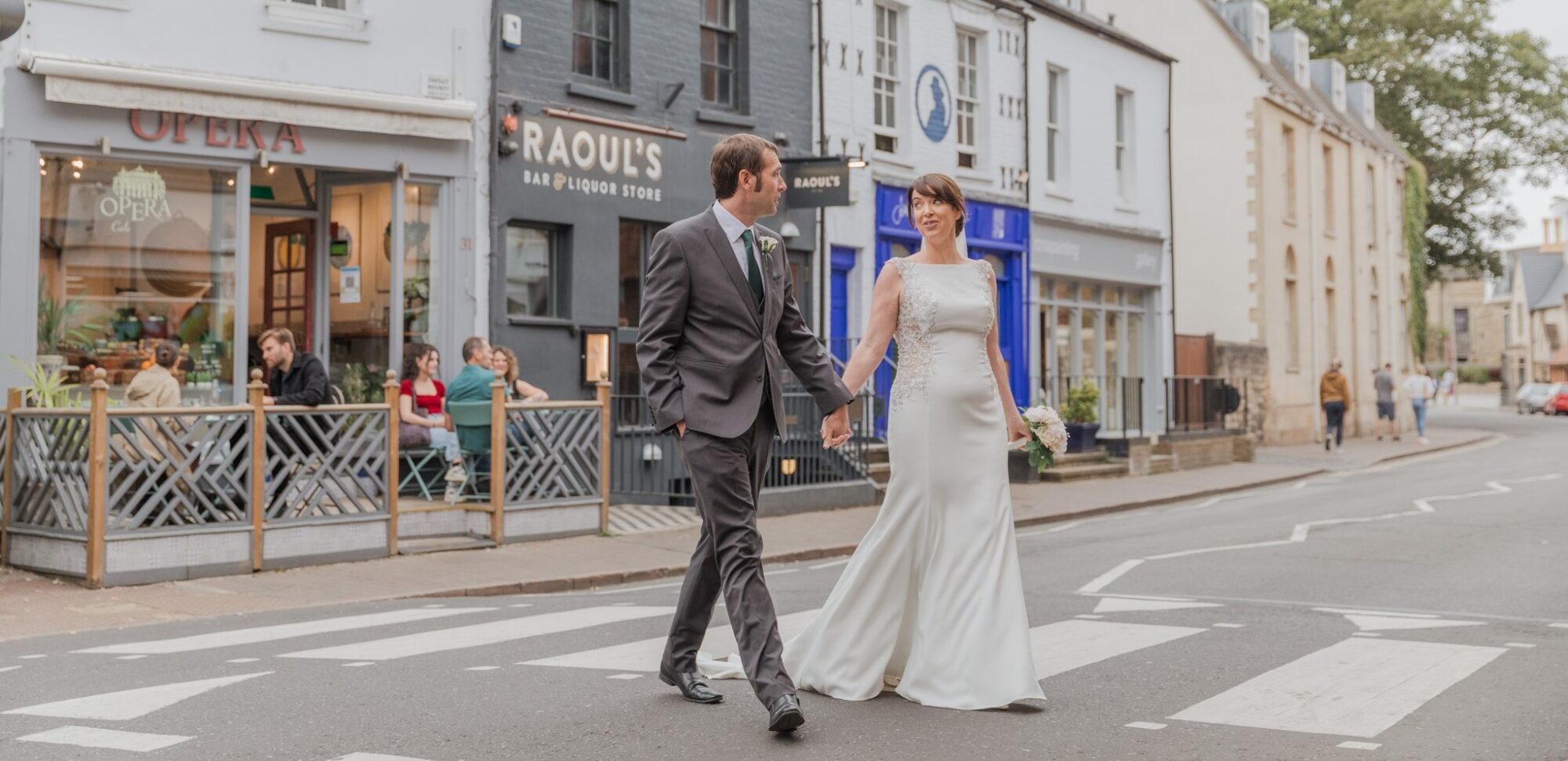 bride groom cross oxford city centre road holding hands oxfordshire wedding photography