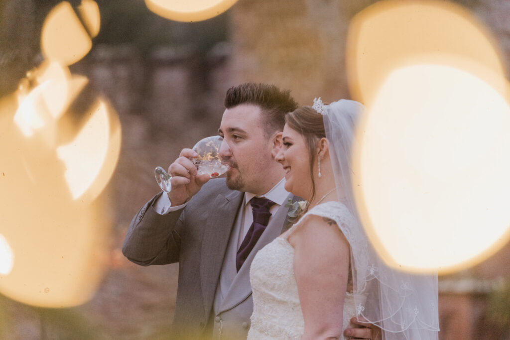 101 groom sips drink with bride shrewsbury venue gardesns oxford wedding photography