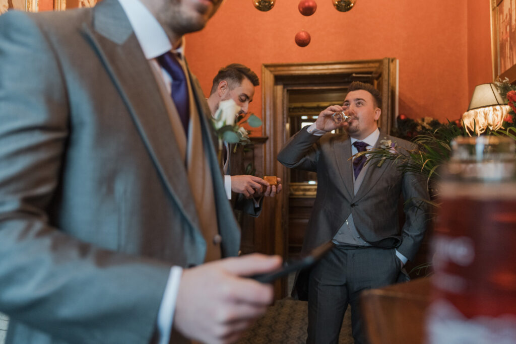 38 groom enjoys drink shrewsbury venue oxfordshire wedding photographers