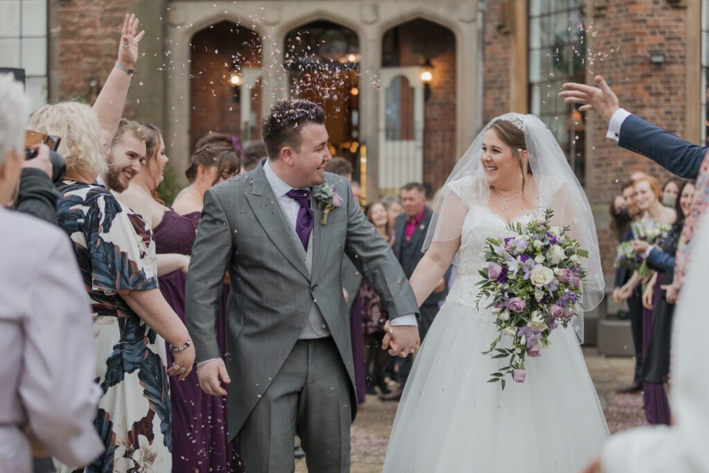 91 happy bride groom hold hands shrewsbury venue confetti parade oxford wedding photographer