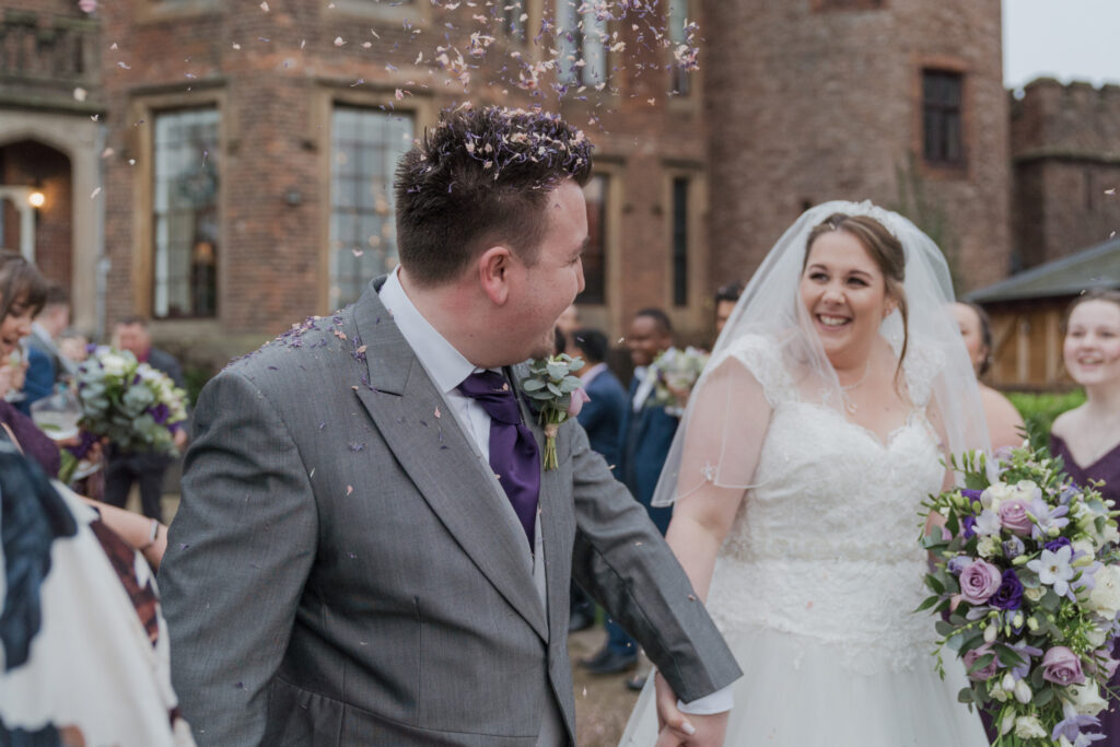 92 smiling bride sees confetti covered groom shrewsbury venue oxford wedding photographers