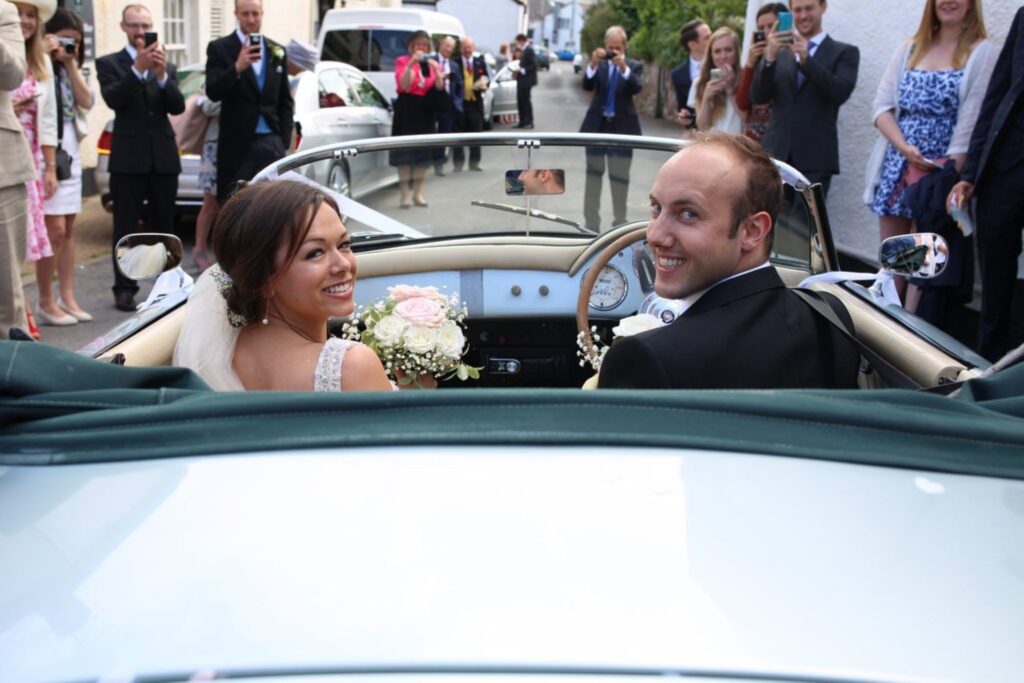 05 guests photograph bride grooms bridal car departure s r urwin wedding photographer oxfordshire