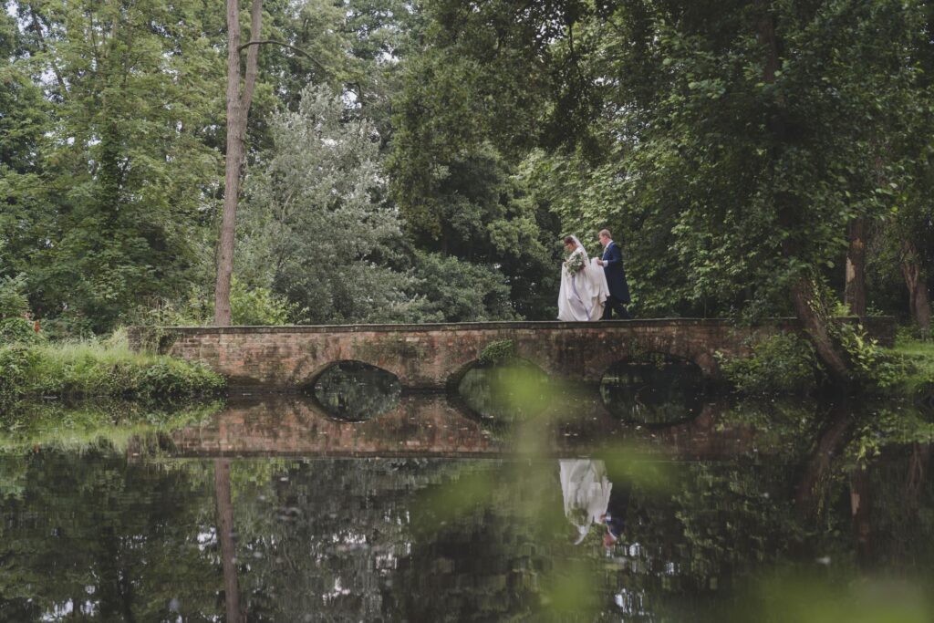 105 bride grooms lake reflection thorganby venue grounds north yorkshire oxfordshire wedding photographer