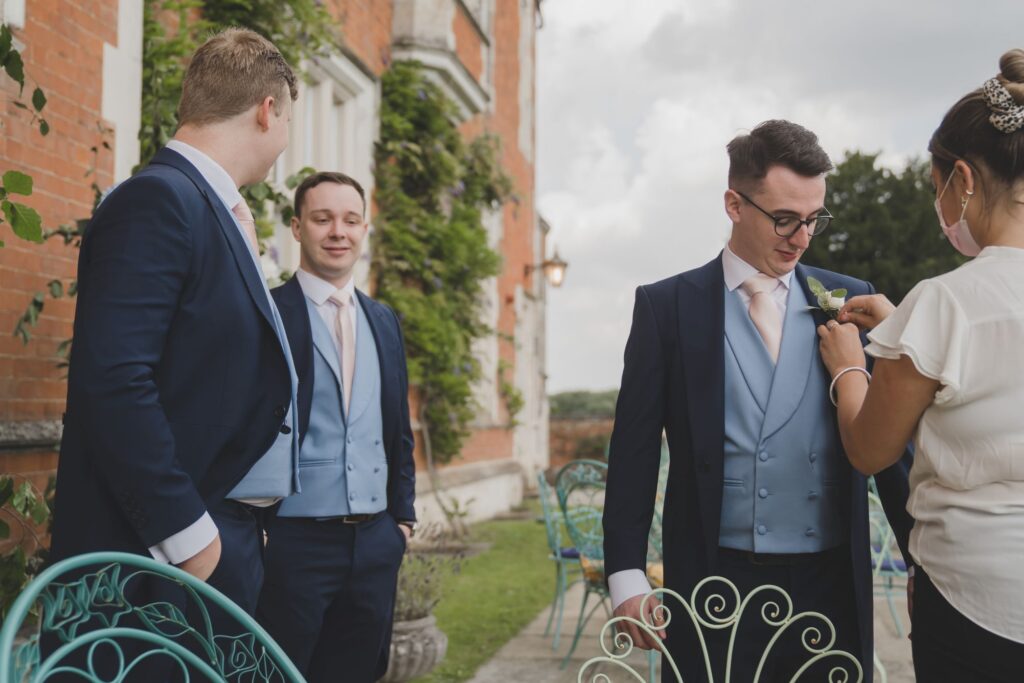 51 groomsmans lapel corsage pinned thorganby venue north yorkshire oxford wedding photographer