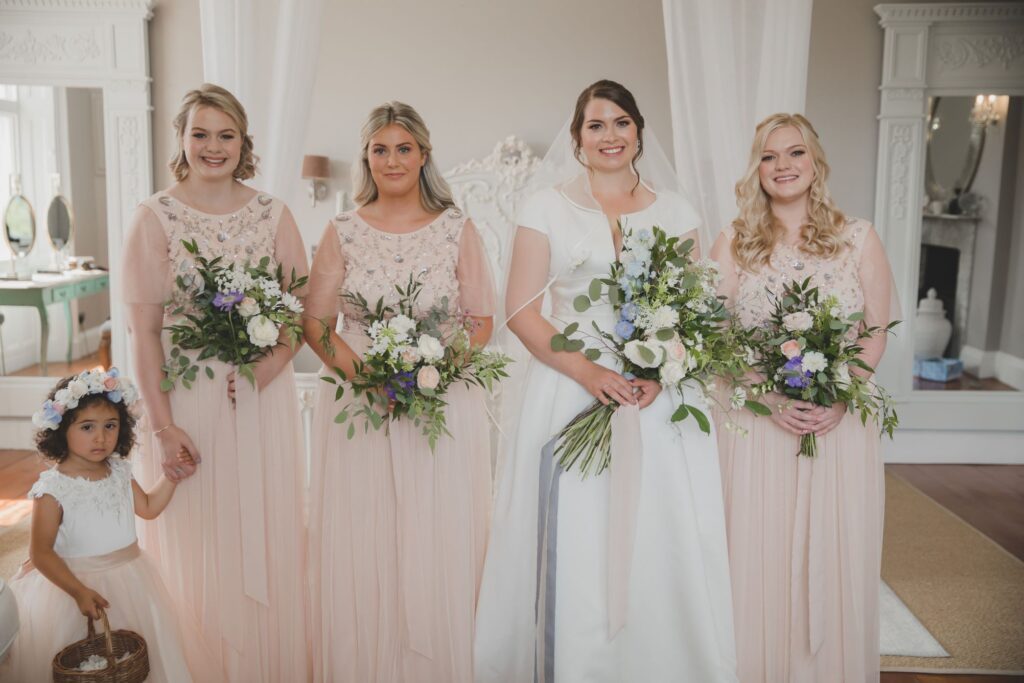 56 bride bridesmaids hold bouquets thorganby venue north yorkshire oxfordshire wedding photography