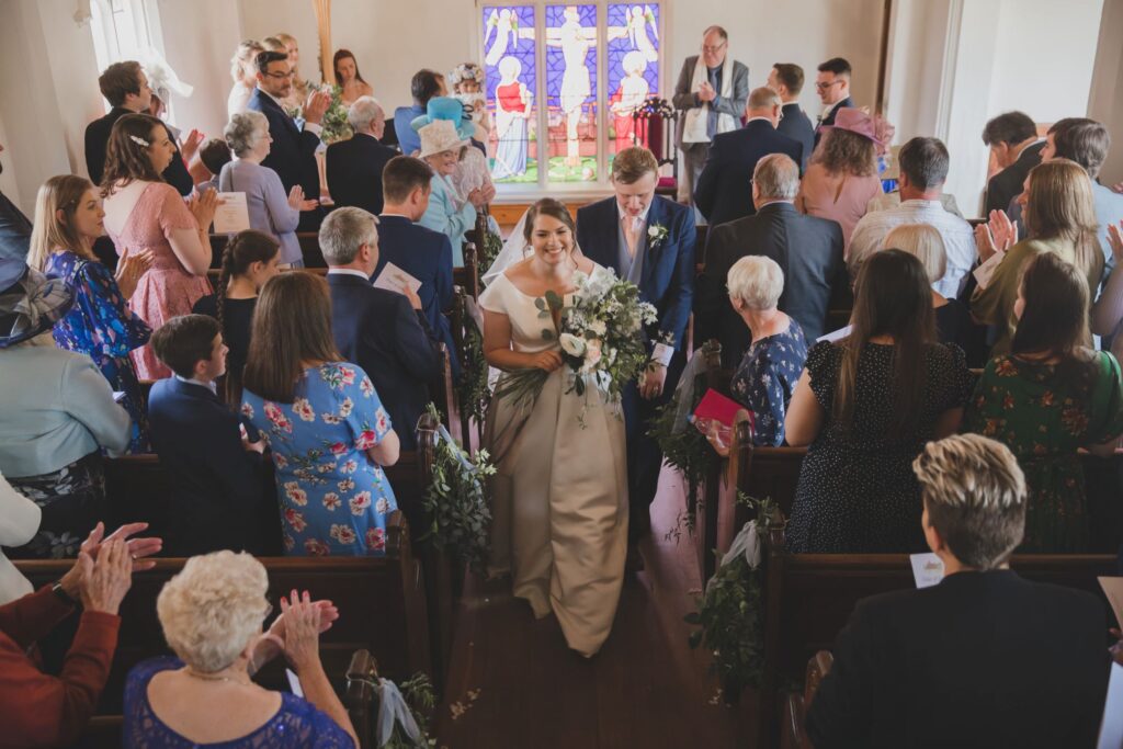 81 ceremony guests applaud bride groom thorganby venue north yorkshire oxford wedding photographer