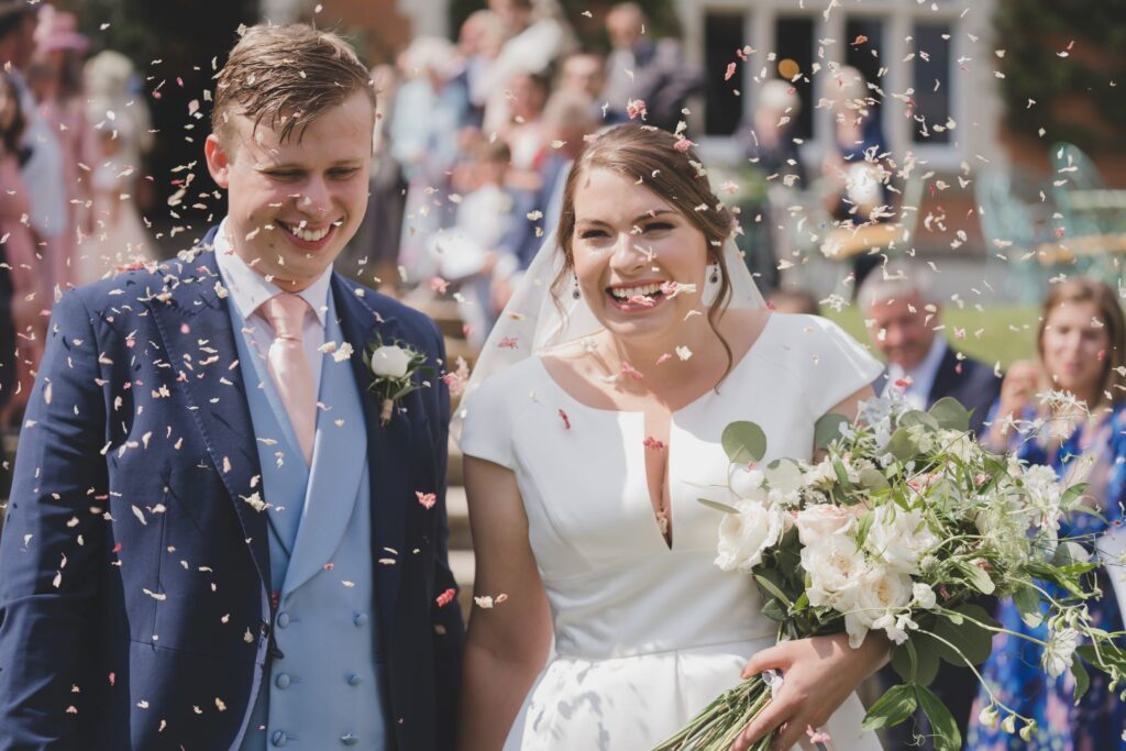86 smiling bride groom enjoy confetti shower thorganby venue oxford wedding photography