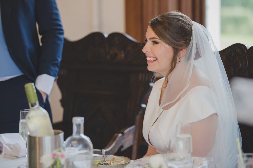 95 bride enjoys grooms speech thorganby venue north yorkshire oxfordshire wedding photography