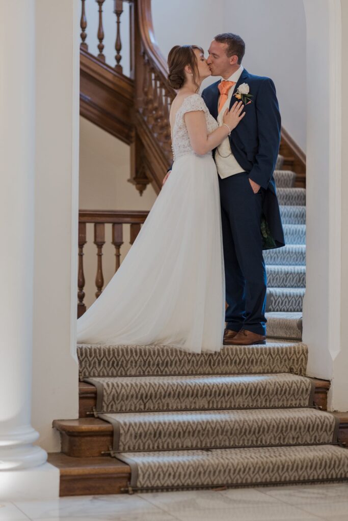 101 bride grooms stairway kiss kings langley hotel watford oxfordshire wedding photographers