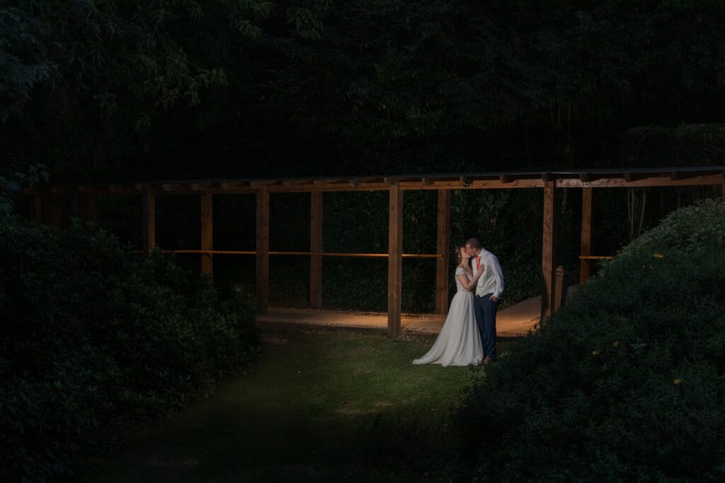 107 bride grooms twilight kiss kings langley hotel gardens watford oxfordshire wedding photographers