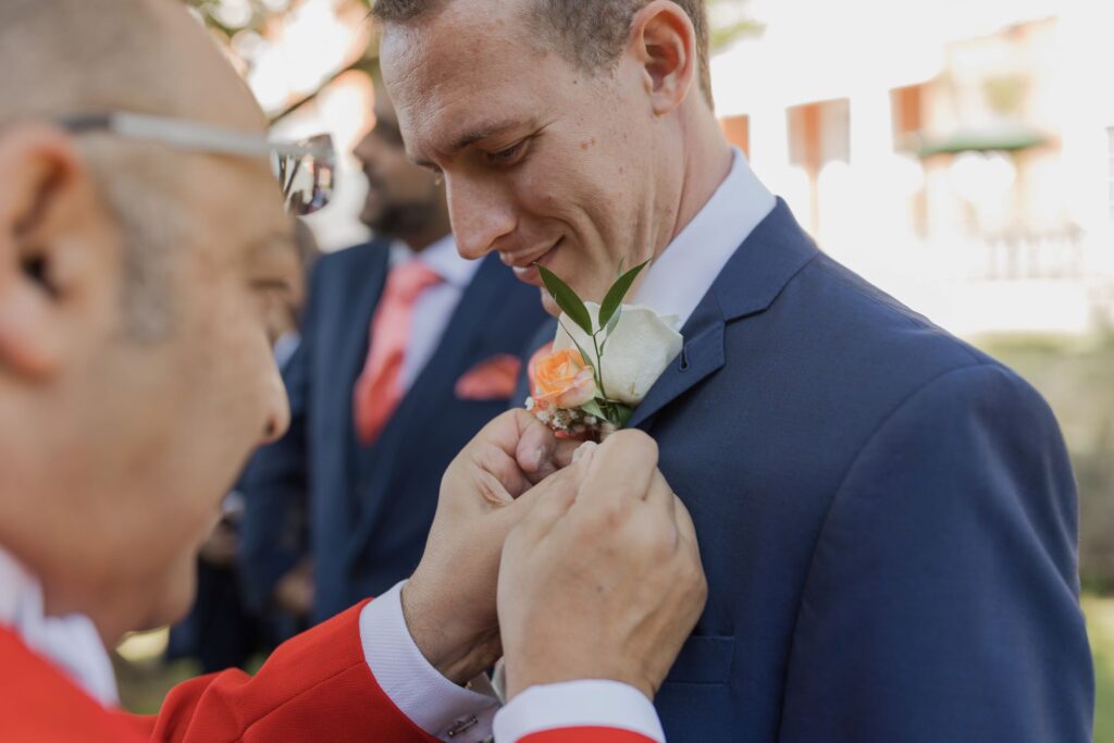23 master of ceremonies fixes grooms lapel corsage hunton park hotel hertfordshire oxfordshire wedding photographers