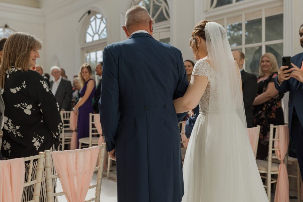 44 guests watch bride enter marriage ceremony kings langley watford oxford wedding photographers