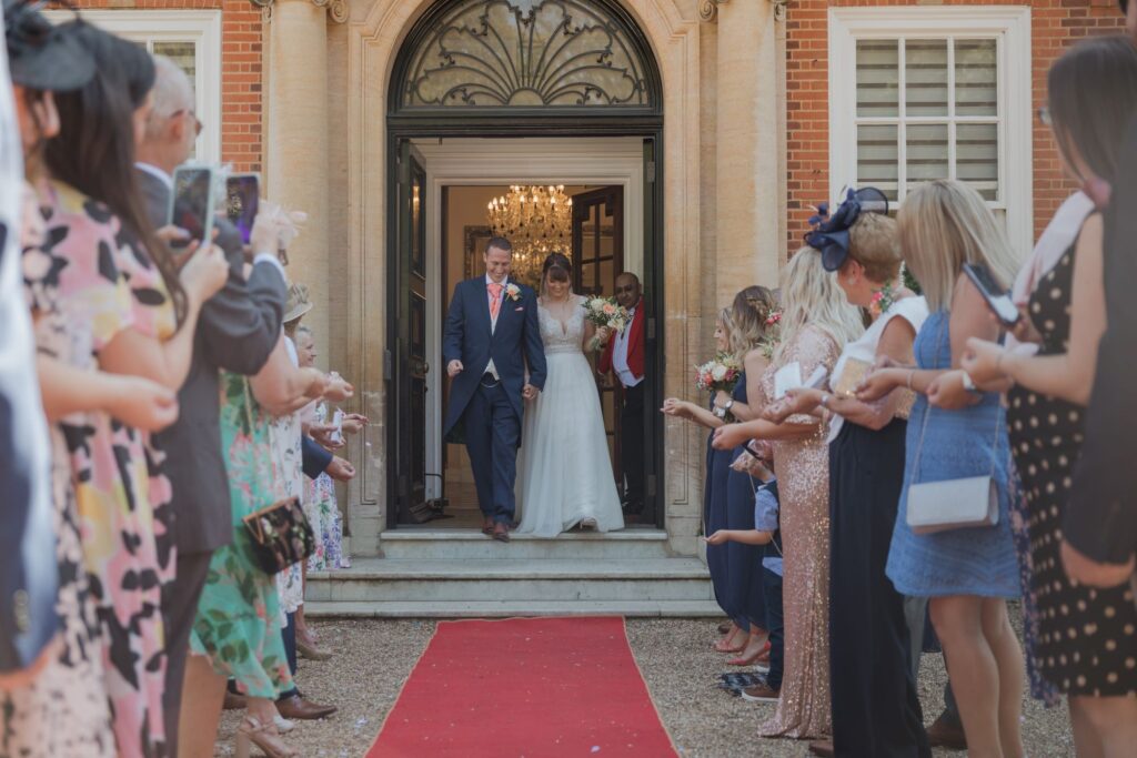 64 bride groom exit marriage ceremony kings langley watford oxfordshire wedding photographers