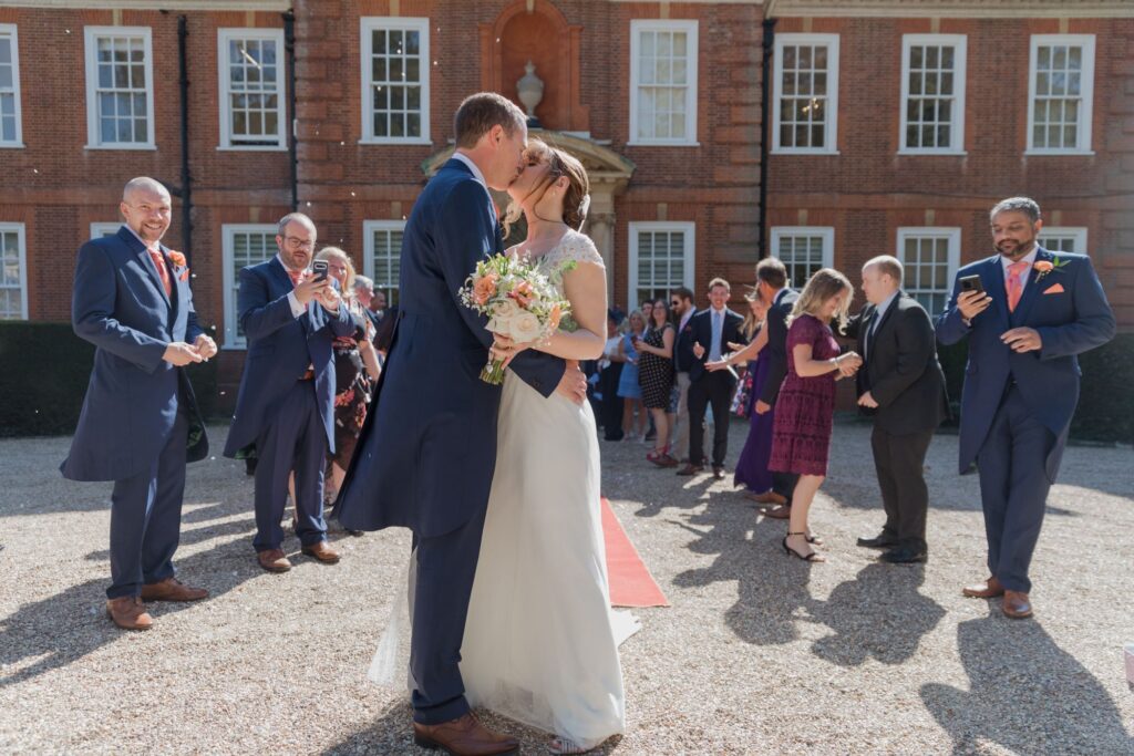 68 guests watch bride groom kiss kings langley watford oxford wedding photography