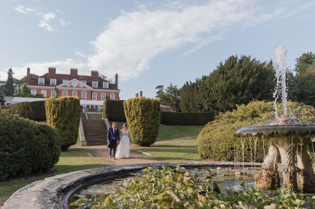 91 bride groom stroll hunton park hotel grounds hertfordshire oxford wedding photographer