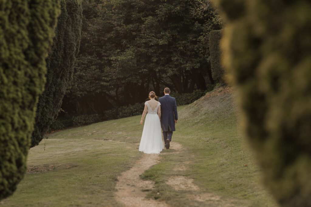 92 bride groom walk holding hands kings langley hotel grounds watford oxford wedding photographers