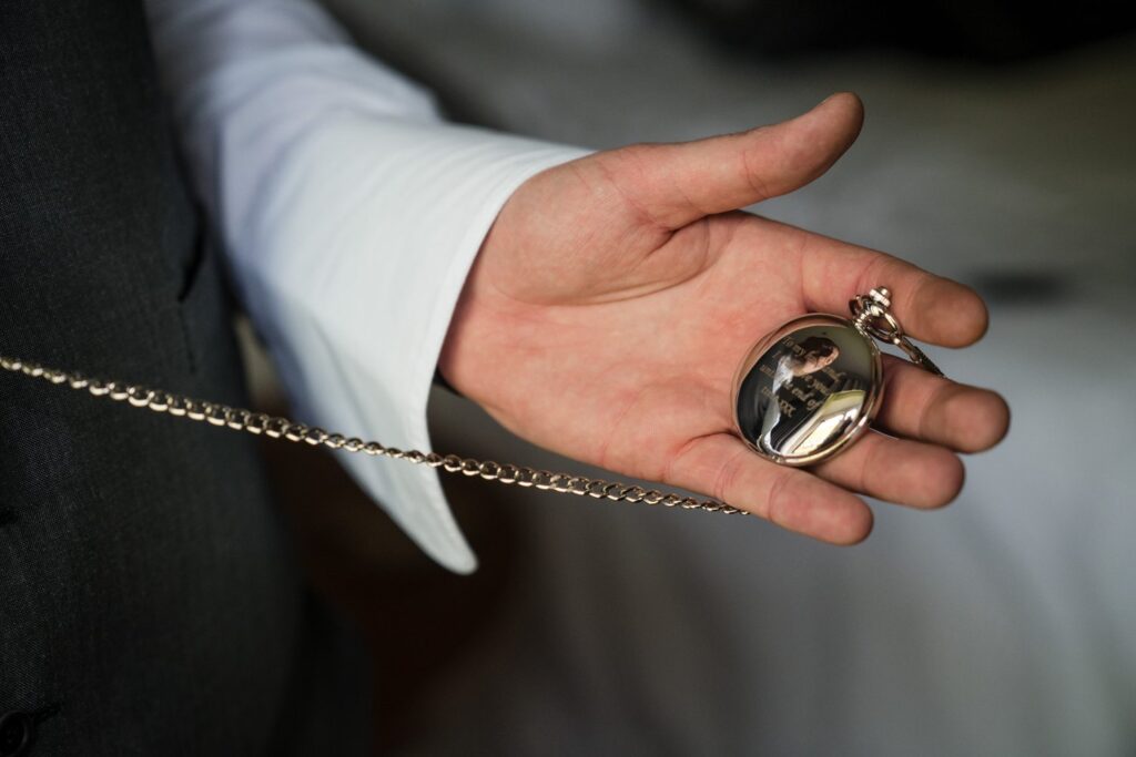 10 grooms pocket watch reflection voco oxford thames groom prep oxfordshire wedding photographer