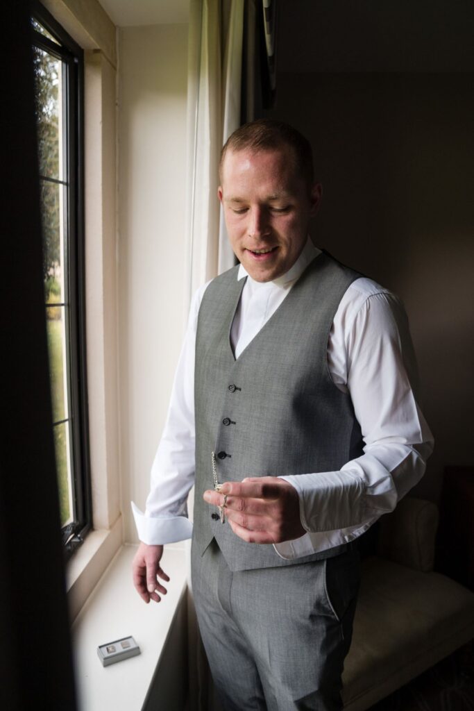 11 groom checks pocket watch gift voco oxford thames oxfordshire wedding photographers