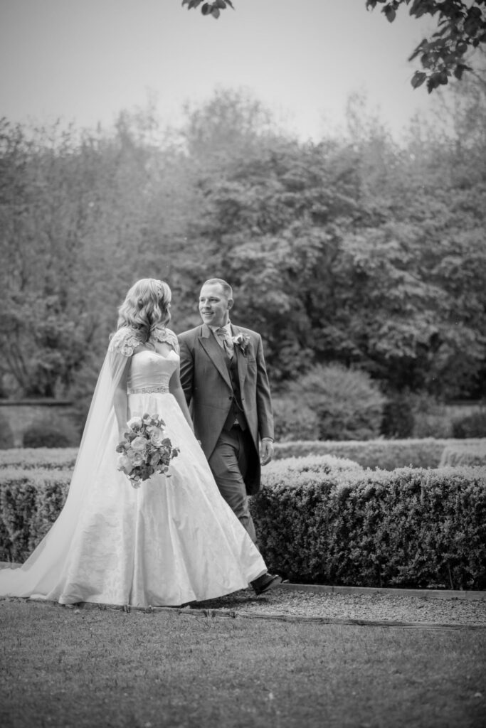 127 bride groom enjoy garden walk ihg hotel sandford oxford oxfordshire wedding photography