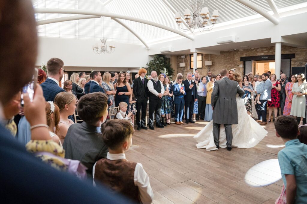 135 guests watch bride grooms first dance ihg hotel sandford oxford oxfordshire wedding photographer