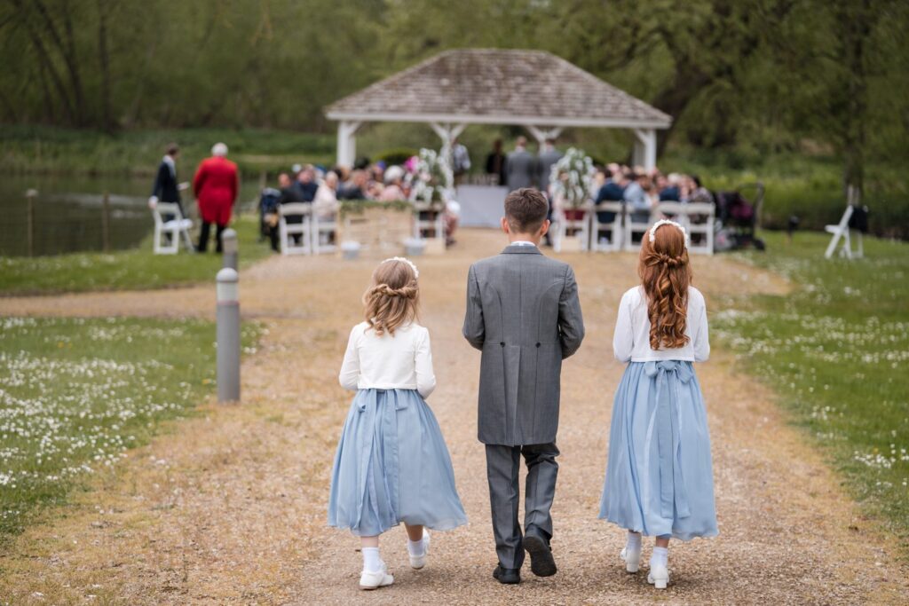 53 flower girls ring bearer approach outdoor ceremony ihg hotel sandford oxford oxfordshire wedding photographers