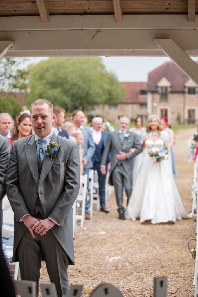 59 bride approaches groom outdoor ceremony ihg hotel sandford oxford oxfordshire wedding photographers