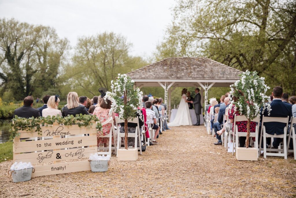 64 guests watch outdoor marriage ceremony ihg hotel sandford oxford oxfordshire wedding photographers